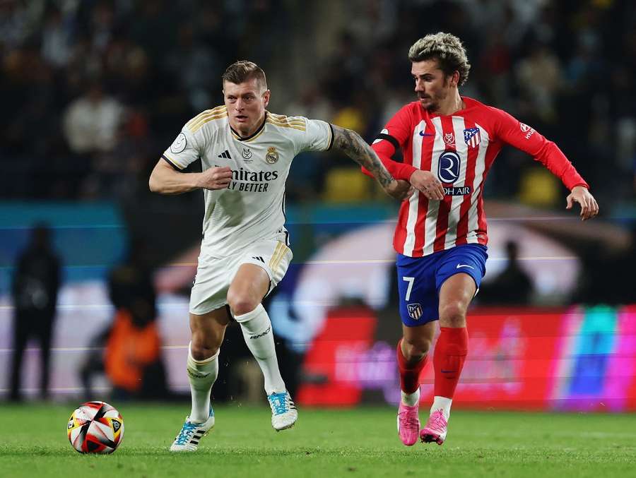 Antoine Griezmann and Toni Kroos battle for the ball