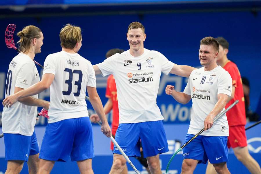 Finland celebrate one of their 42 goals against China
