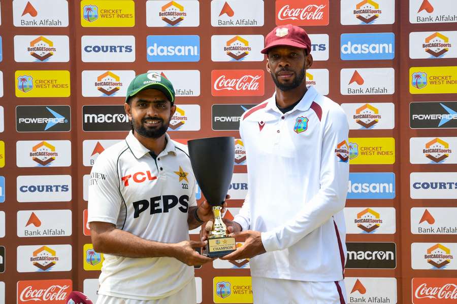 Babar Azam (L) and Roston Chase (R) share the trophy after the series was drawn 1-1. Babar Azam (L) and Roston Chase (R) share the trophy after the series was drawn 1-1.
