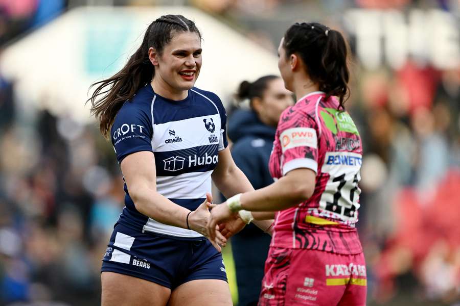 Ilona Maher shakes hands with Pip Hendy after making her debut for the Bristol Bears