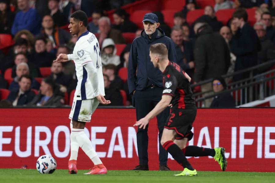 Marcus Rashford, left, in action for England as Thomas Tuchel watches on