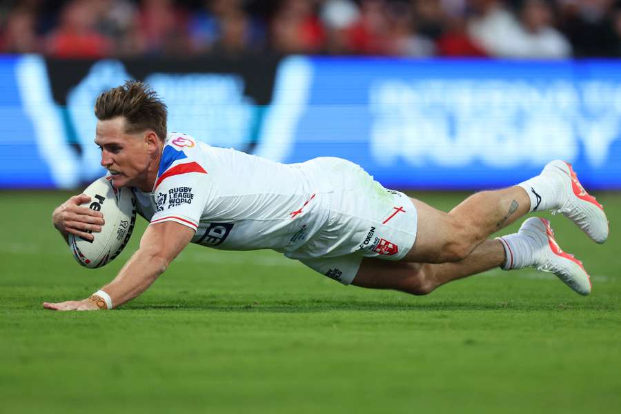 England's AJ Brimson scoring a try against Tonga at the Rugby League World Cup.