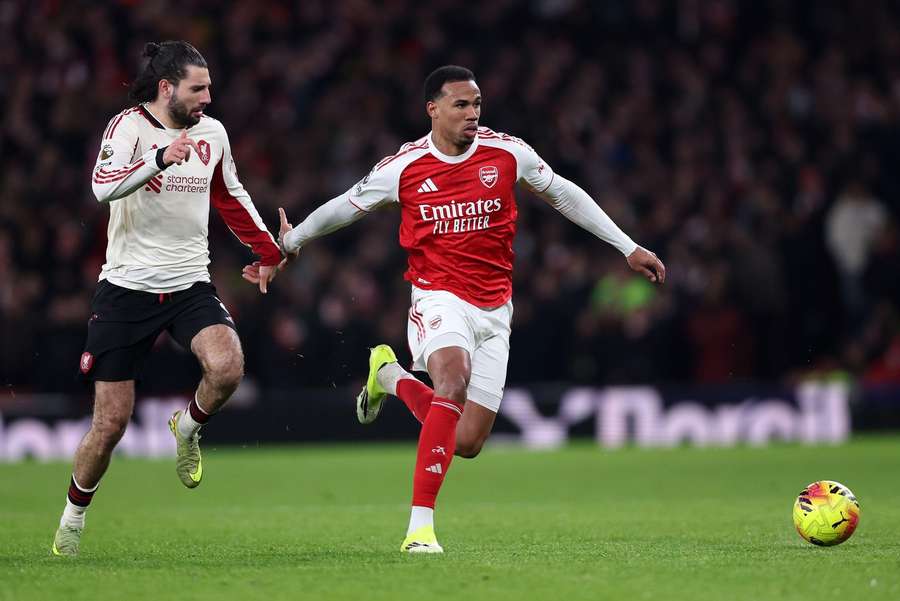 Arsenal's Gabriel tussles with Liverpool's Dominik Szoboszlai at the Emirates Stadium
