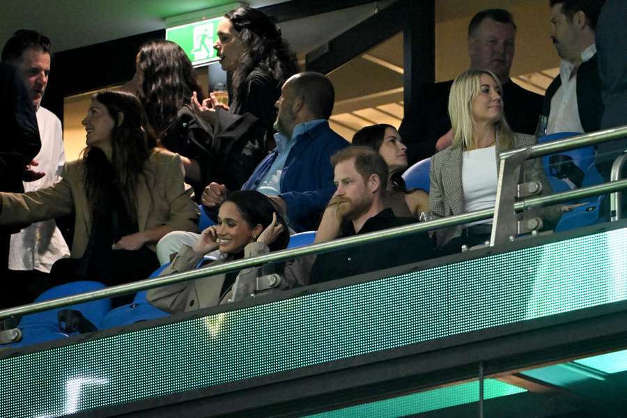 Prince Harry and Meghan Markle in the stands during the Waratahs' Friday night game against Moana Pasifika. 