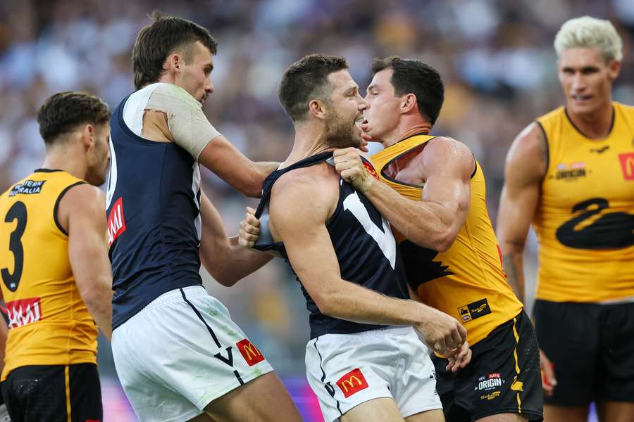 Victoria's Sam Darcy and Toby Greene tussle with Western Australia's Jaeger O'Meara on Saturday. Victoria's Sam Darcy and Toby Greene tussle with Western Australia's Jaeger O'Meara on Saturday.