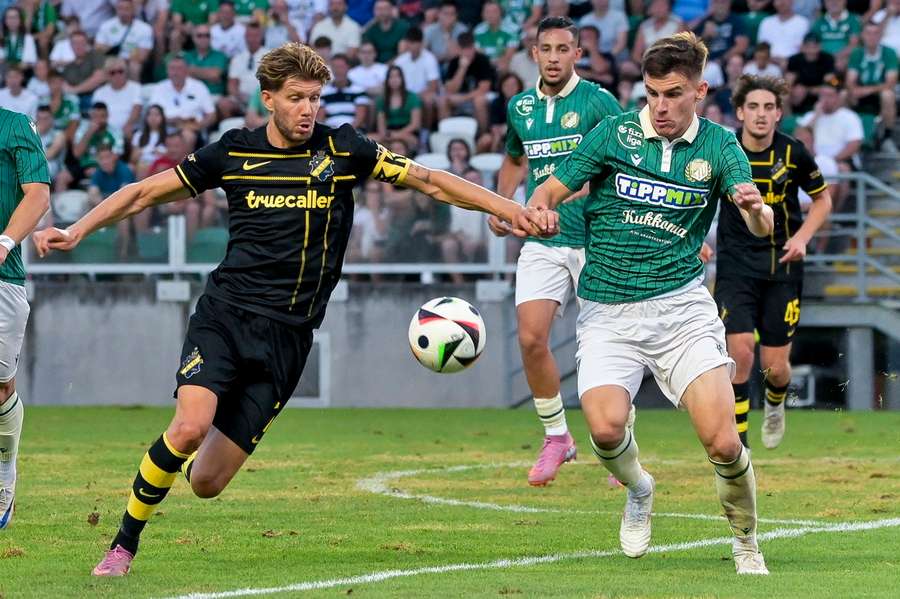 AIK's Anton Saletros (left) and Milan Vitalis Gyor contest the ball