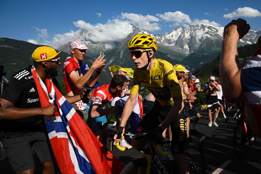 Jumbo-Visma's Danish rider Jonas Vingegaard wearing the overall leader's yellow jersey cycles in the final ascent of Saint-Gervais-les-Bains