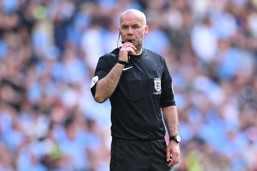 Referee Paul Tierney blows his whistle during the FA Cup final