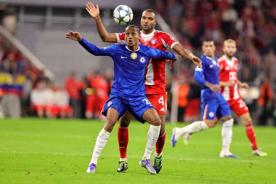 Chelsea's Joao Pedro and Bayern Munich's Jonathan Tah battle for the ball