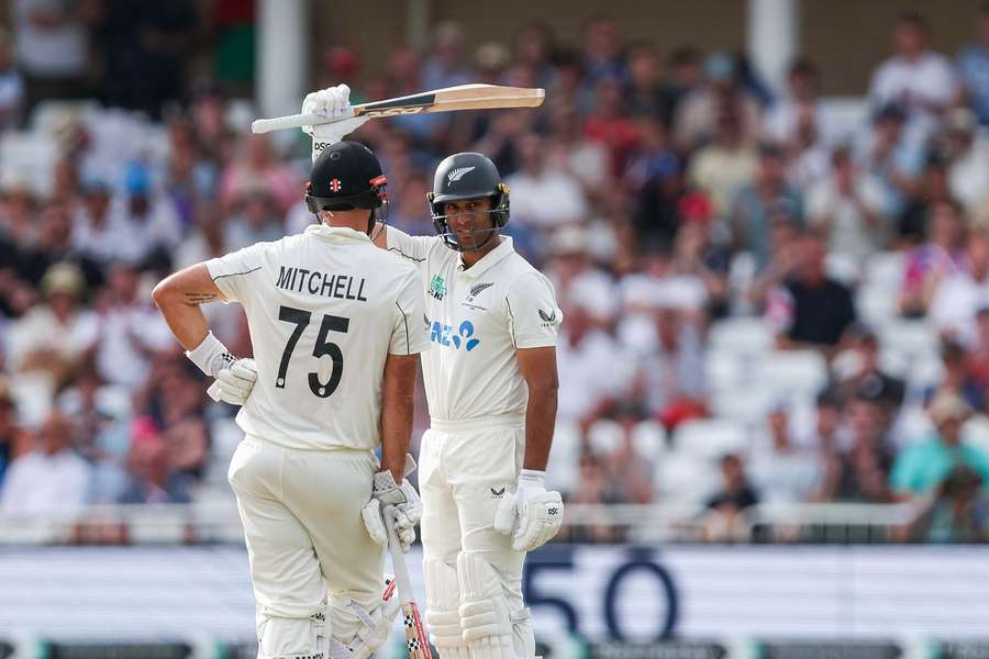 Ravindra celebrates his 50