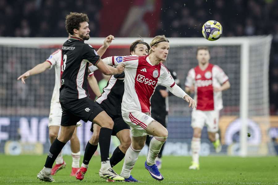 Ajax's Kasper Dolberg battles with NEC's Philippe Sandler (L) and Kodai Sano