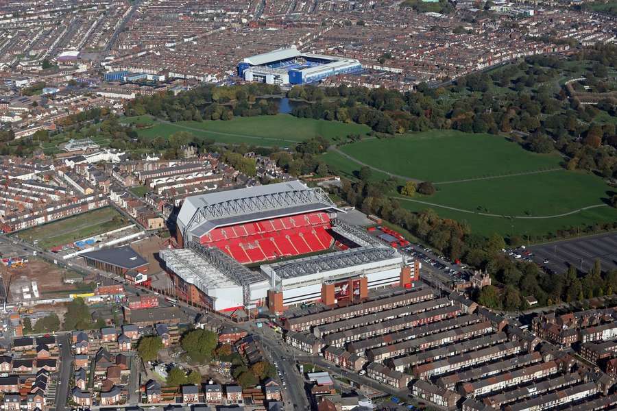 An aerial view of Anfield with Goodison Park in the background across Stanley Park