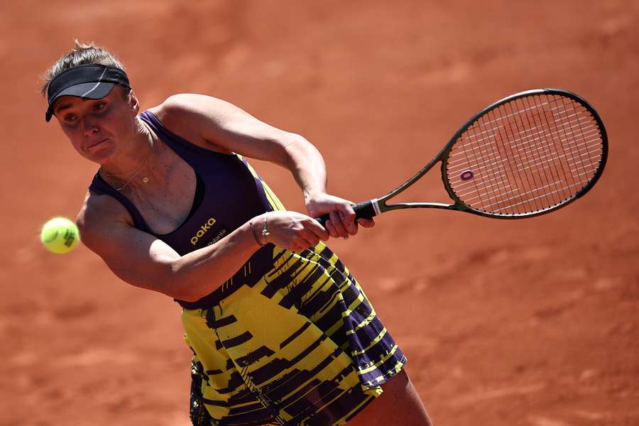 Svitolina returns the ball against Hunter