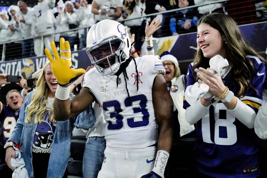 Vikings RB Aaron Jones celebrates a touchdown with fans on Christmas against the Detroit Lions (2025) Vikings RB Aaron Jones celebrates a touchdown with fans on Christmas against the Detroit Lions (2025)