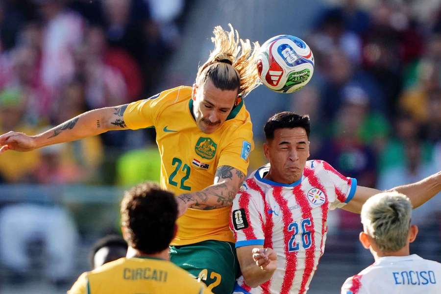 Alexandro Maidana and Jackson Irvine compete for a header.