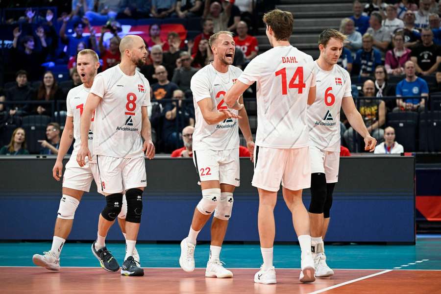Team Denmark celebrates a point during men's volleyball European Championships match against the Netherlands
