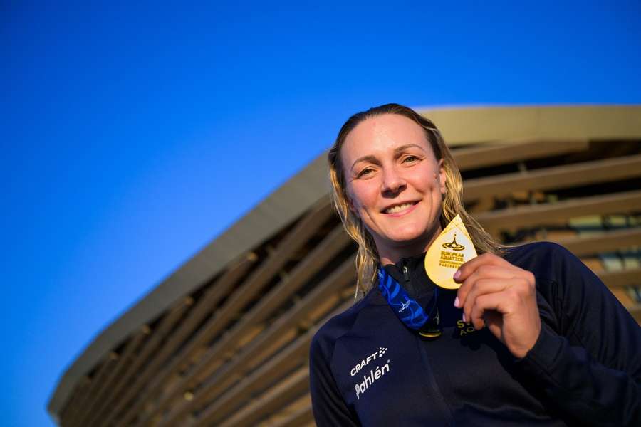 Sjostrom holds her gold medal aloft in Paris