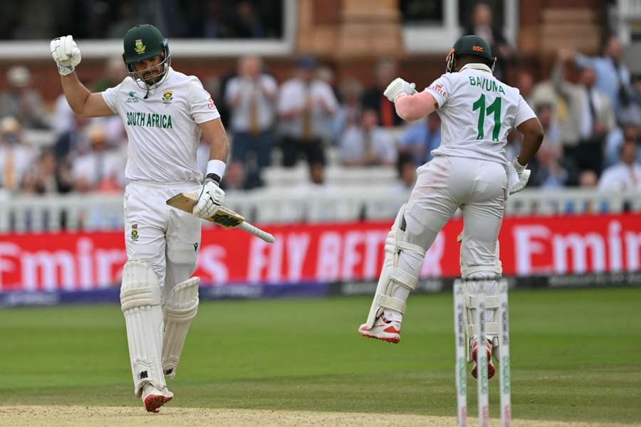Aiden Markram (L) and South Africa's captain Temba Bavuma react after Markram reached his century at Lord's