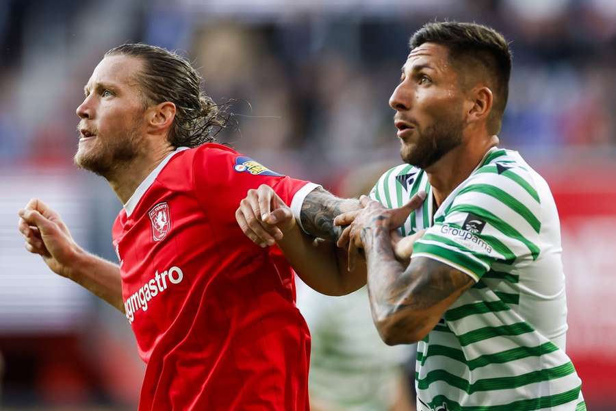 FC Twente's Wout Weghorst battles with Ferencvaros defender Mariano Gomez