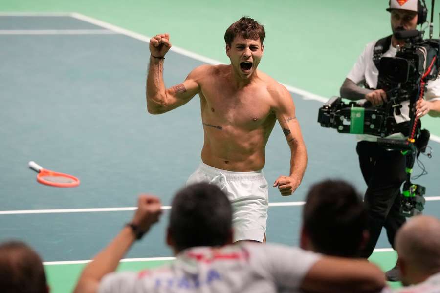 Flavio Cobolli celebrates sending Italy into the Davis Cup final