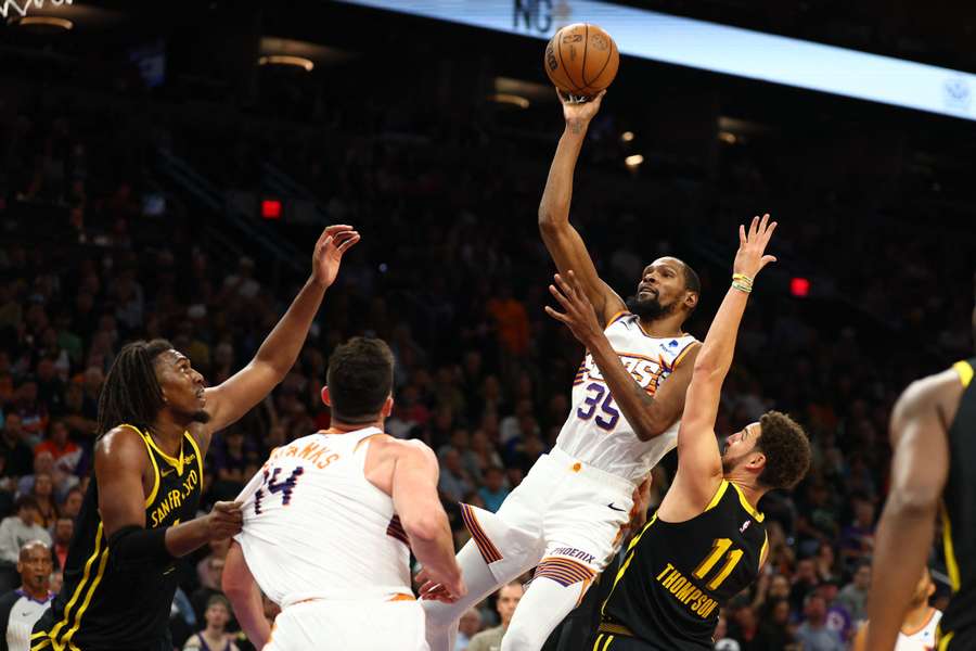 Phoenix Suns forward Kevin Durant (35) shoots the ball against the Golden State Warriors in the second half