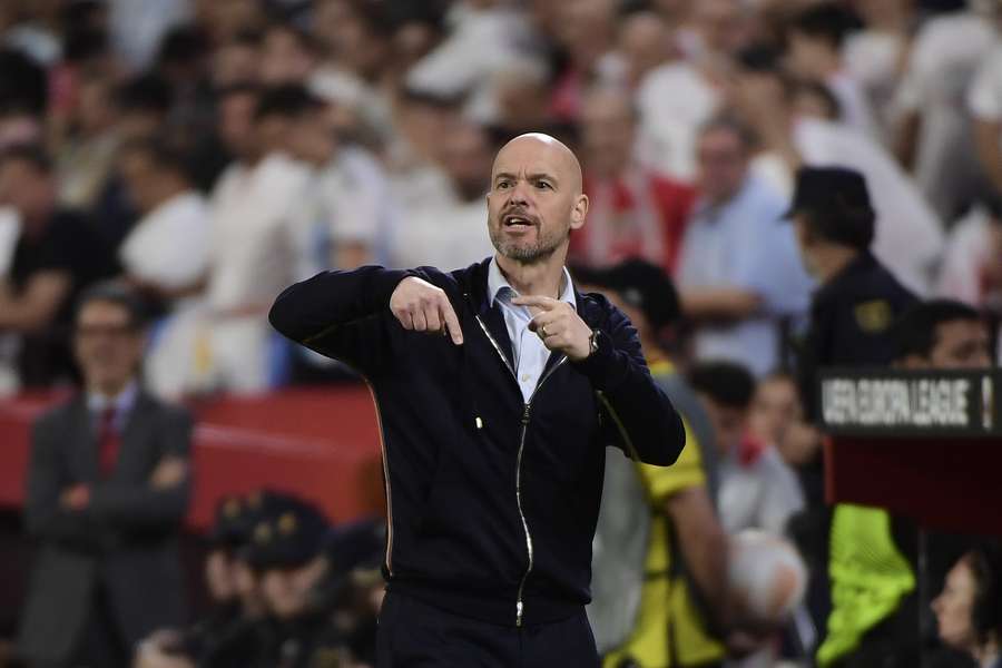 Manchester United manager Erik ten Hag attempting to direct his team as they collapsed at Sevilla