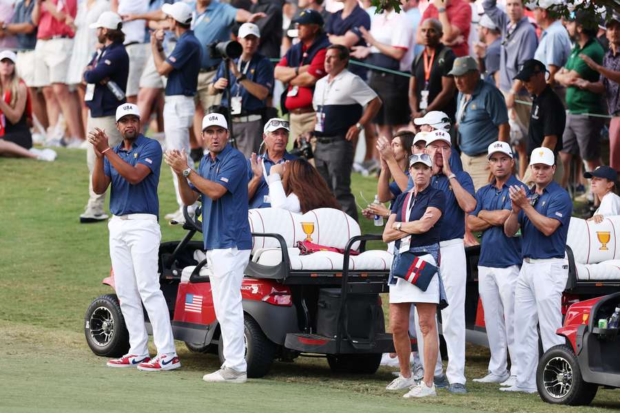 Members of the United States team watch on