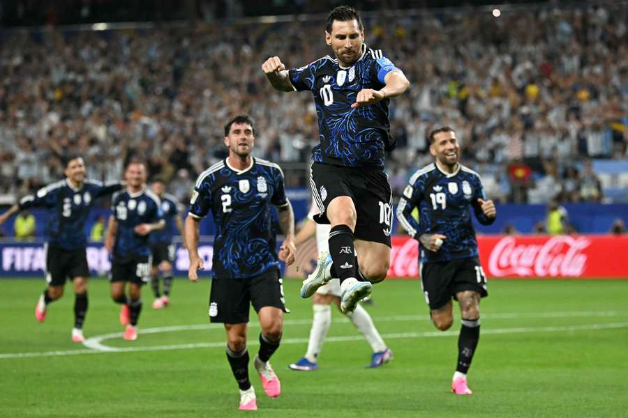 Lionel Messi celebrates scoring against Jordan
