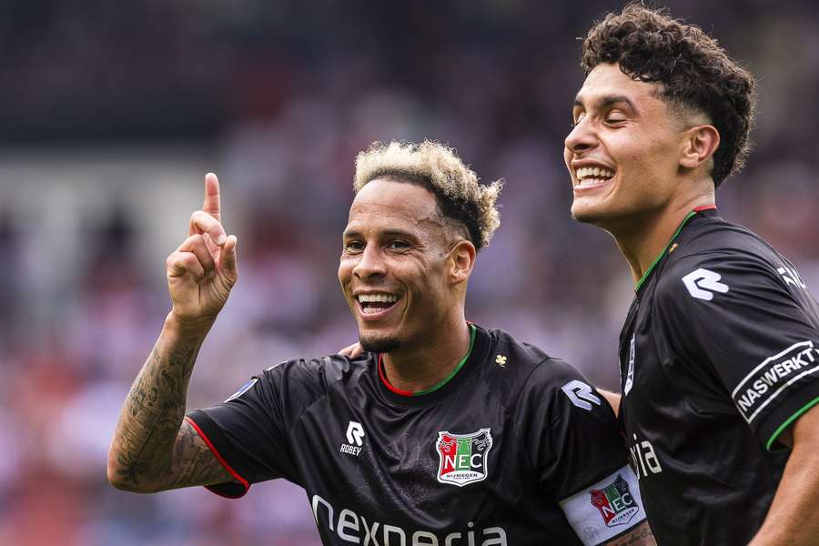 NEC's Tjaronn Chery (L) celebrates scoring against Willem II NEC's Tjaronn Chery (L) celebrates scoring against Willem II