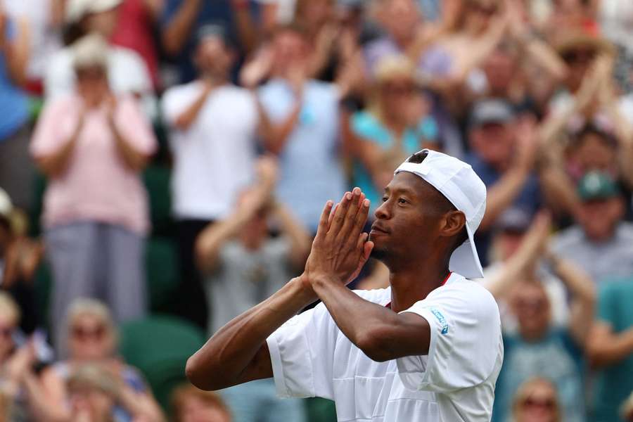 Chris Eubanks celebrates with the crowd after his five-set win