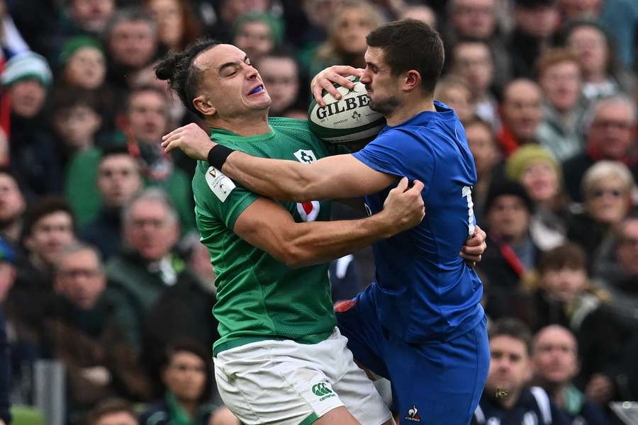 Ireland's James Lowe (L) and France's Thomas Ramos (R) battling for the ball in last year's Six Nations clash. 