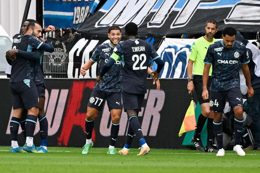 Marseille's Malian midfielder Nouhoum Kamissoko celebrates with teammates Marseille's Malian midfielder Nouhoum Kamissoko celebrates with teammates