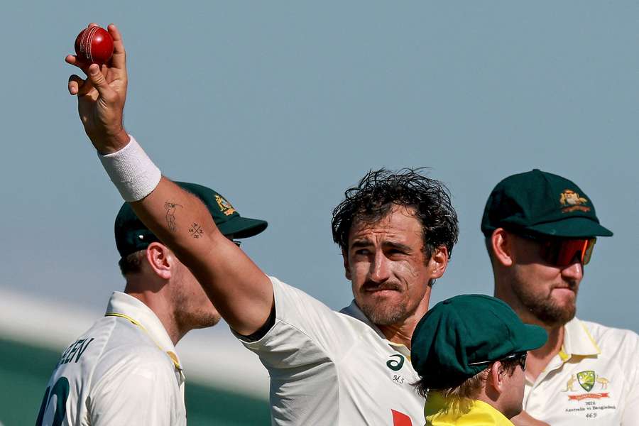 Mitchell Starc salutes the crowd after picking up 10 wickets in the game Mitchell Starc salutes the crowd after picking up 10 wickets in the game