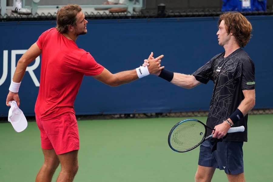 Virtanen (left) and Rublev shake hands at the end of the match Virtanen (left) and Rublev shake hands at the end of the match
