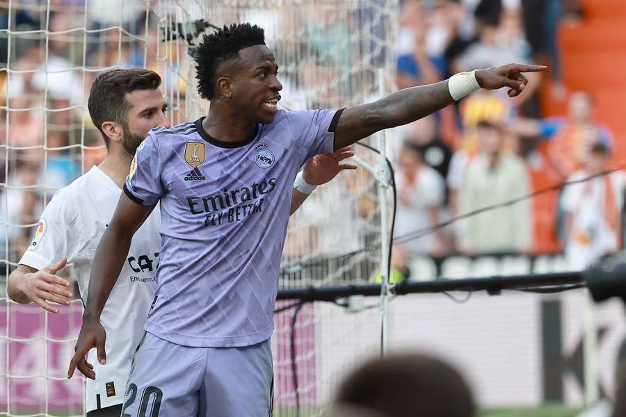 Real Madrid's Brazilian forward Vinicius Junior reacts to being insulted pointing at the stands 