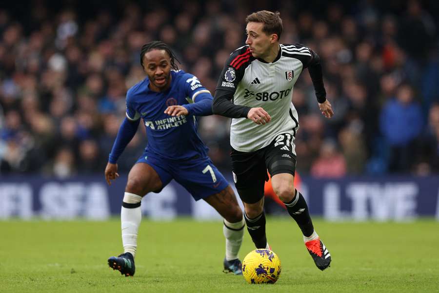 Chelsea's Raheem Sterling vies with Fulham's Timothy Castagne
