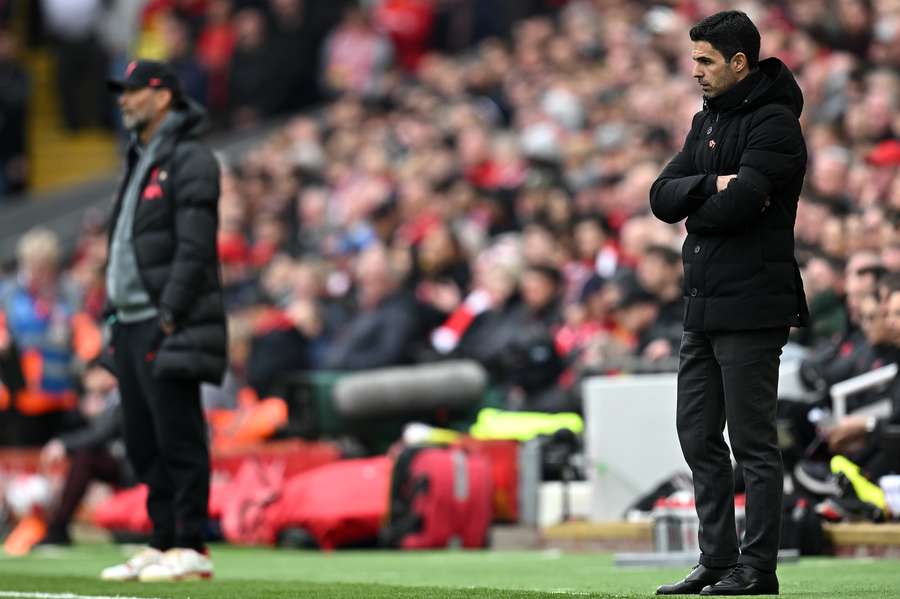 Liverpool's German manager Jurgen Klopp and Arsenal's Spanish manager Mikel Arteta watch the players from the touchline