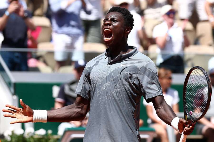 Moise Kouame celebrates winning the second set during his second round match against Adolfo Daniel Vallejo