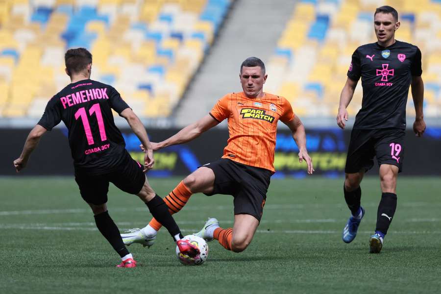 Shakhtar and Metalist challenge for the ball in Kyiv