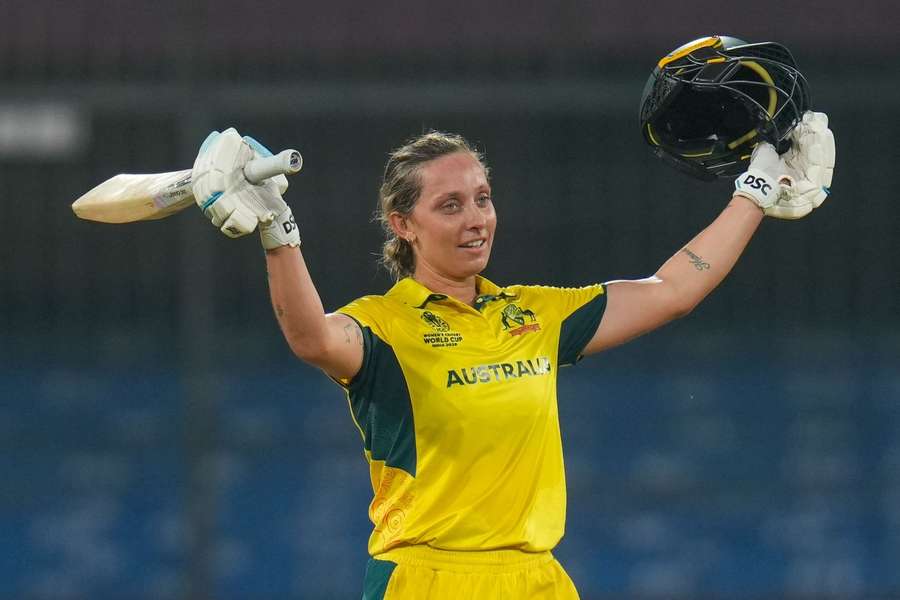 Australia's Ashleigh Gardner celebrates her century during the ICC Women's Cricket World Cup match against England on Wednesday