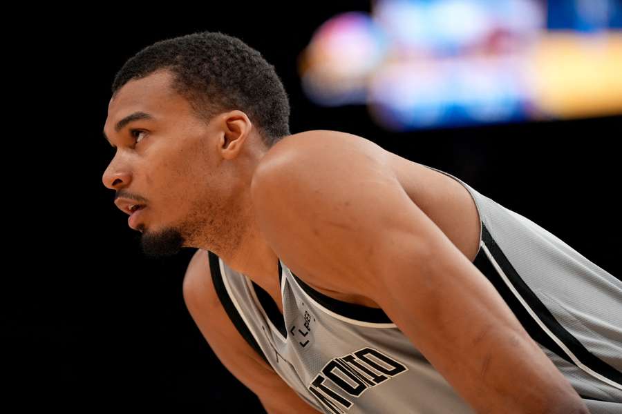San Antonio Spurs center Victor Wembanyama stands on the court during a break in the action against the Golden State Warriors