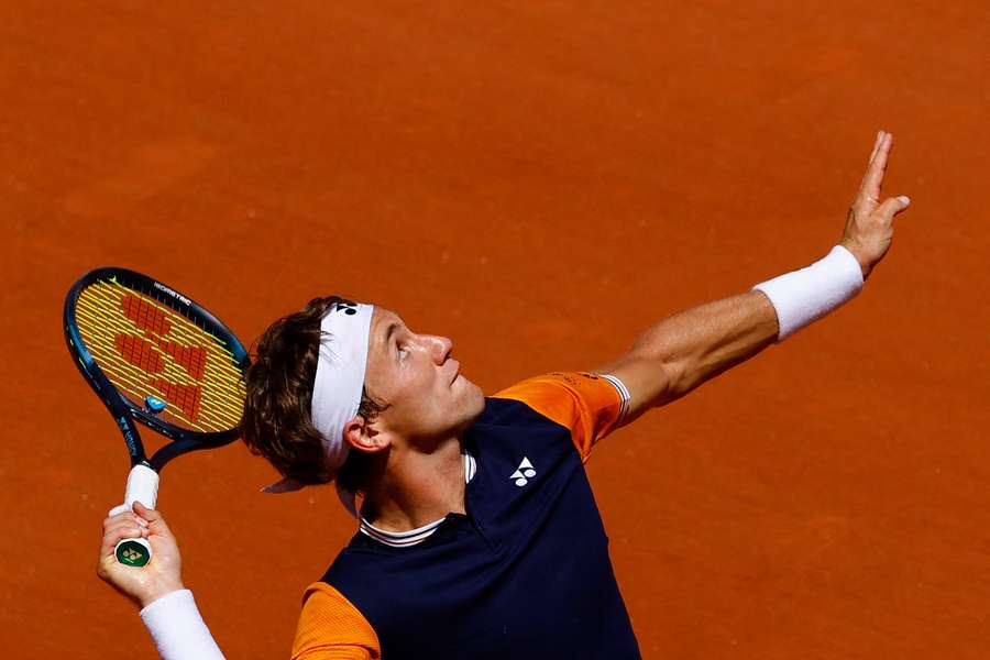 Casper Ruud plays a smash shot against Elias Ymer