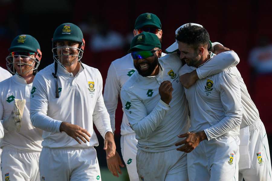 Maharaj (far right) celebrates with his South Africa team-mates