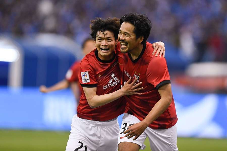 Japan's Urawa Red Diamonds' players celebrate scoring