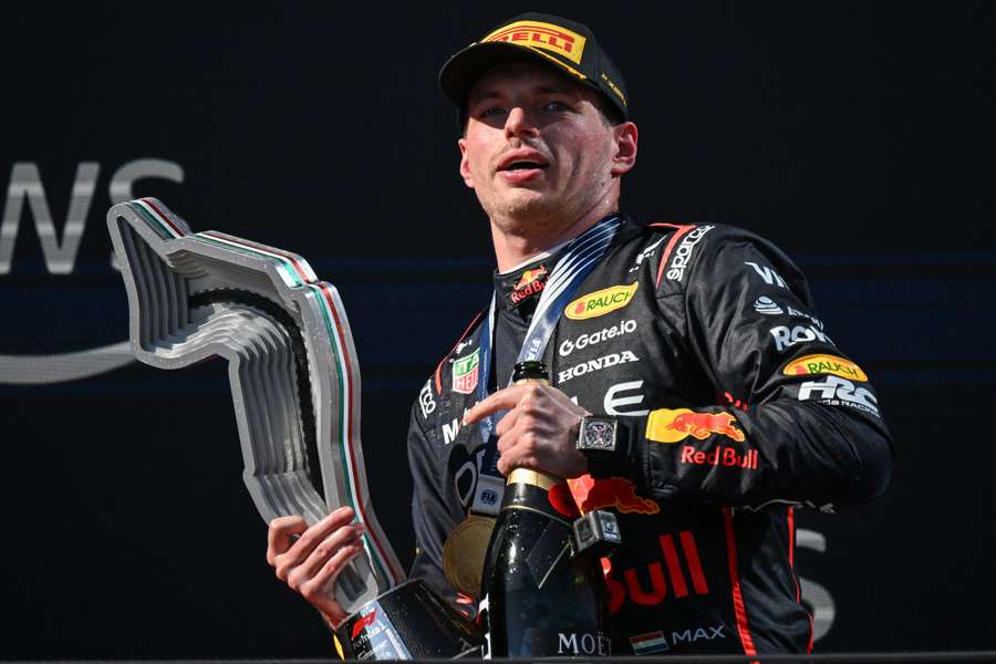 Max Verstappen celebrates with the trophy after winning the Italian Grand Prix