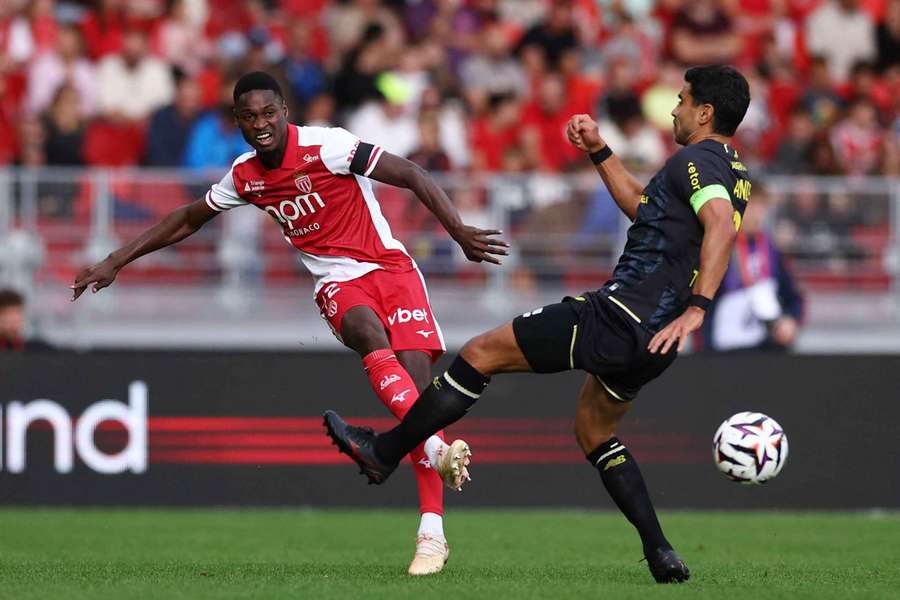 Monaco's Sadibou Sane in action with Lille's Benjamin Andre