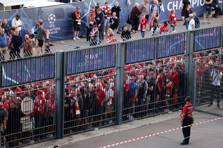 Liverpool fans stand outside unable to get into the stadium in time for the Champions League final between Liverpool and Real Madrid