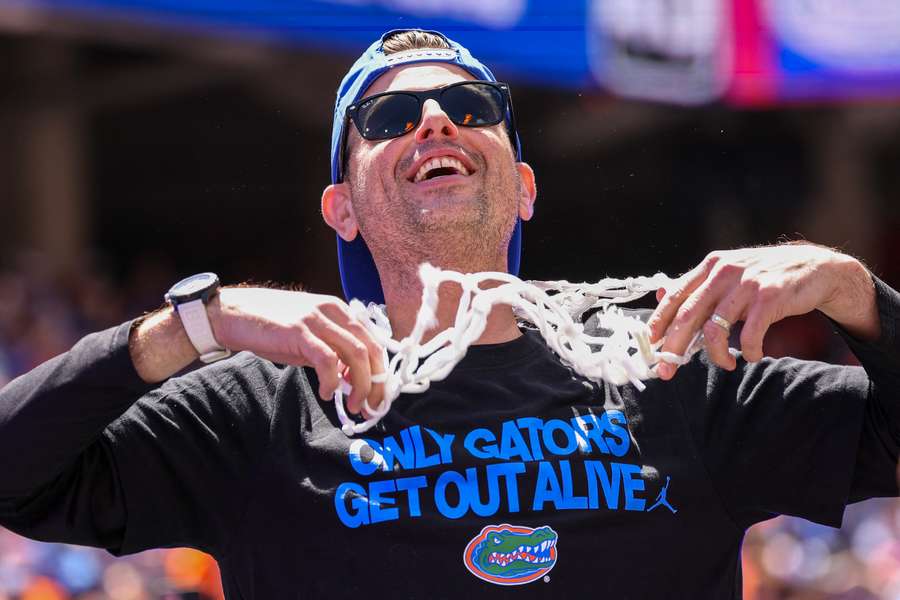 Florida men's basketball head coach Todd Golden celebrating the team's championship win in front of fans back home (2025)