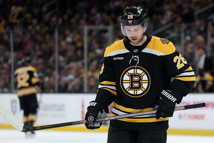 Elias Lindholm looks on after a whistle during a game vs. New Jersey Devils (2025)
