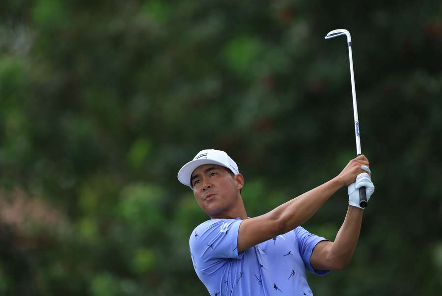 Justin Suh of the United States hits his first shot